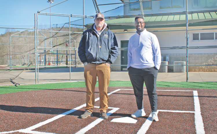 Lumpkin County Parks & Rec Field Maintenance Supervisor Steve Cuny (left) and Athletic Director Ahmad Kamara stand at home plate on one of two renovated Cloverleaf ballfields, which feature artificial turf infields and natural grass outfields.
