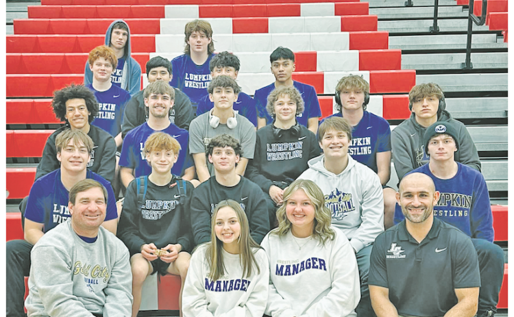 The Lumpkin County boys’ wrestling team celebrates their win following the Morgan County Duals.