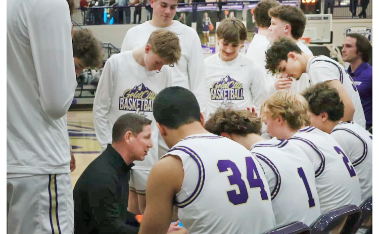 Lumpkin County Head Coach Chris Faulkner talks strategy with his team as they take on the Tigers.
