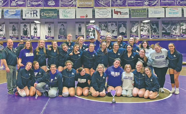 The Lumpkin County Girls Wresting Team celebrates its Area Championship victory.