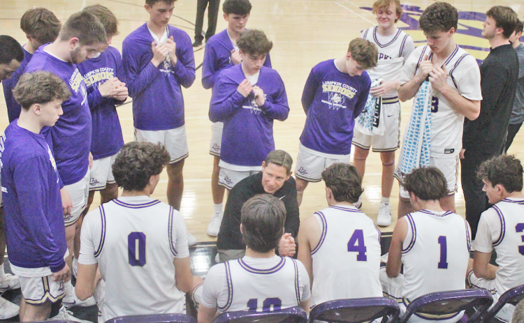 Head Coach Chris Faulkner rallies his team to Lumpkin’s historic win over Johnson.