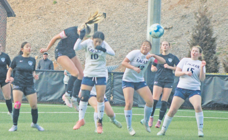 Lumpkin County standout Kaitlyn Johnson angles a header during a recent game.