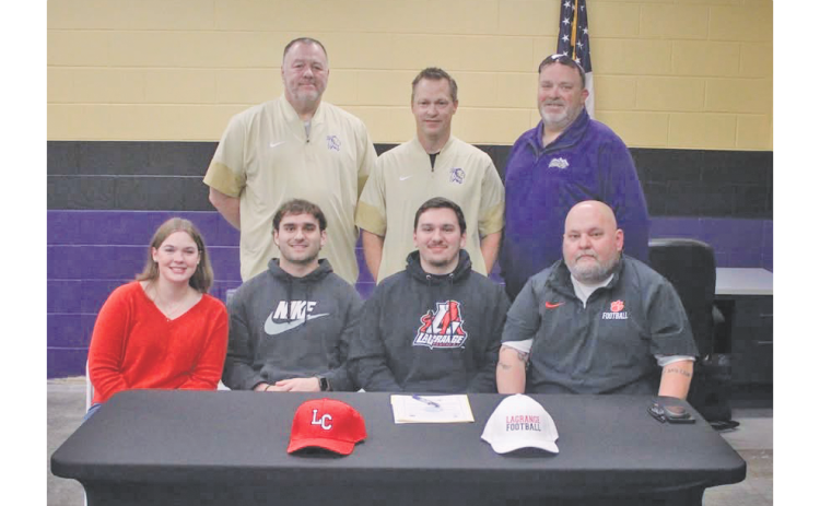 Jacob Baloga celebrates his college commitment alongside his family and coaches.
