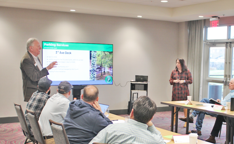 Rome Mayor Jim Boho and Downtown Development Authority Director Suzanne Roberts review parking solutions with the visiting Dahlonega City Council during a retreat earlier this year.