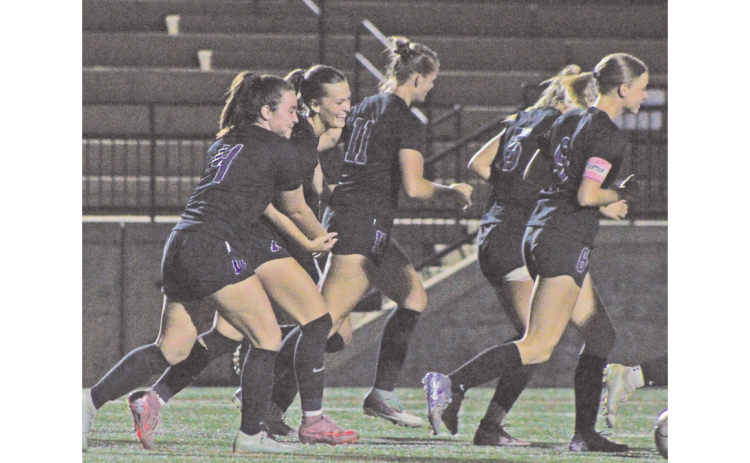 Sophia Manisy and Carlie Fugich celebrate a Lumpkin County goal together.