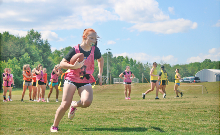 Addison Parker makes a play during last week’s tryouts for the  Lumpkin County High School flag football team. The season is set to begin in October.