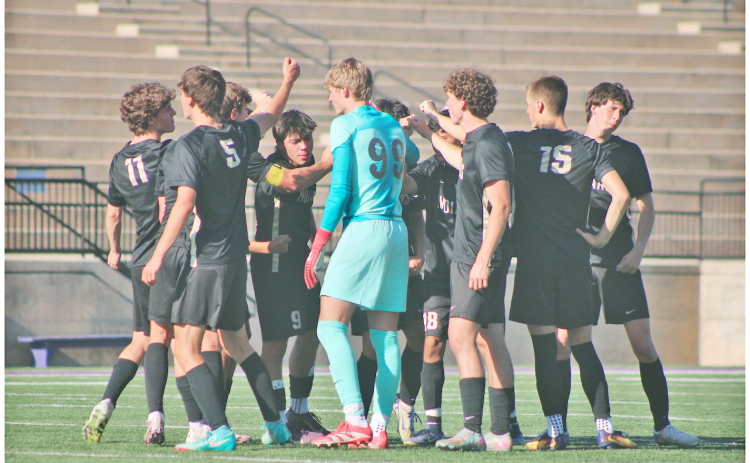 The Lumpkin County boys soccer team huddles up before a match this season.