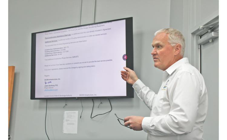 Water and Sewage Authority Executive Director Sean Phipps gestures toward a letter from DCCM requesting a six month extension and $265,673 in additional construction phase services to complete the Cane Creek Wastewater Treatment Plant.