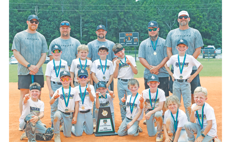 The Lumpkin County 8U baseball team celebrates with its State Championship trophy.