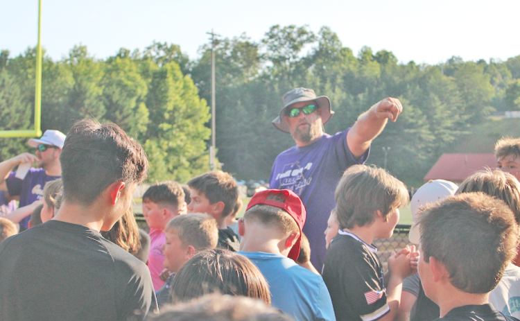 Assistant Coach Jake Estenson directs young participants during the recent summer camp.