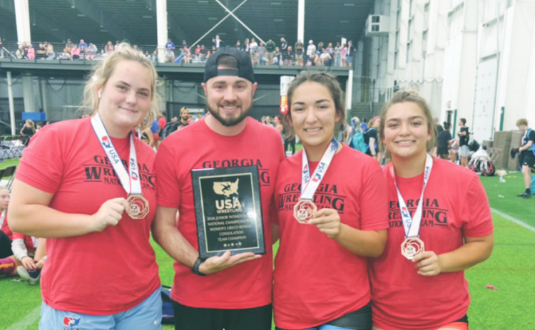 Pictured, from left, Faith Jones, Scott DeGraff, Mathiel Mendoza and Natalie Mendoza represented Lumpkin with distinction at the Womens National Duals in Indiana.