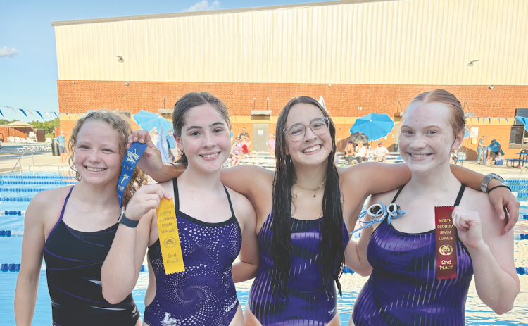 Pictured, from left, Ellie Moye, Abigail Herrit, Amelia Turk and Madison Barrick celebrate their finishes after facing off in a recent race.