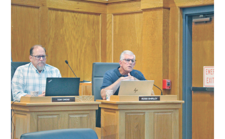 Dahlonega City Councilman Ross Shirley, seated to the right of Councilman Tony Owens, makes a motion to accept the presented fiscal budget under one condition.