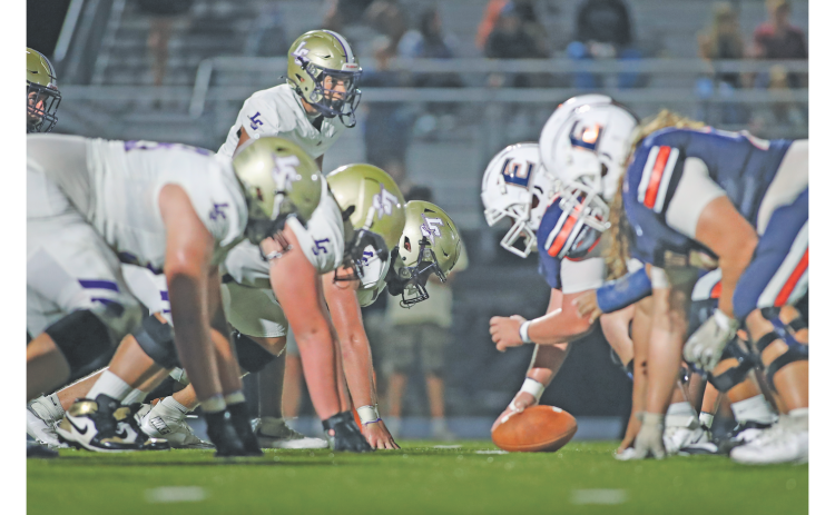 Lumpkin County’s defensive line faces off against East Forsyth last Friday night.