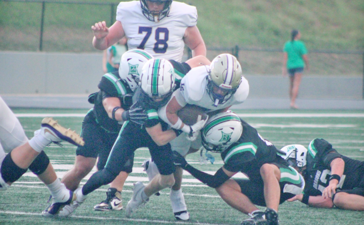 Alvarez fights for extra yards en route to his record-breaking performance of 318 rushing yards. 