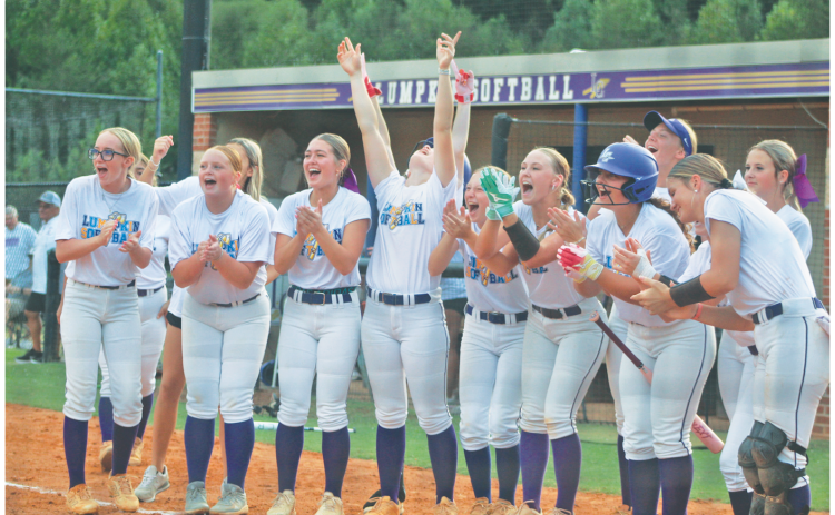 The Lady Indians celebrate a Riley Dyer home run during last week’s matchup against Morgan County.