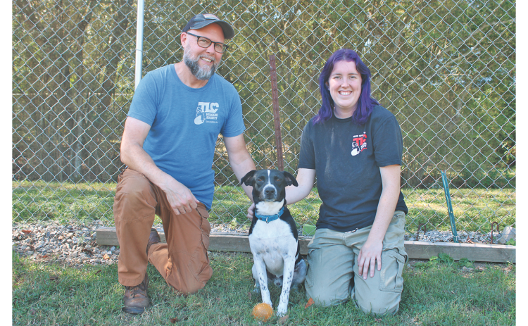 TLC Humane Society Director Sean Bailey, Goose and Animal Caregiver Elizabeth Gray (pictured from left) are ready to raise the “woof” at Saturday’s Bark in the Park festival.