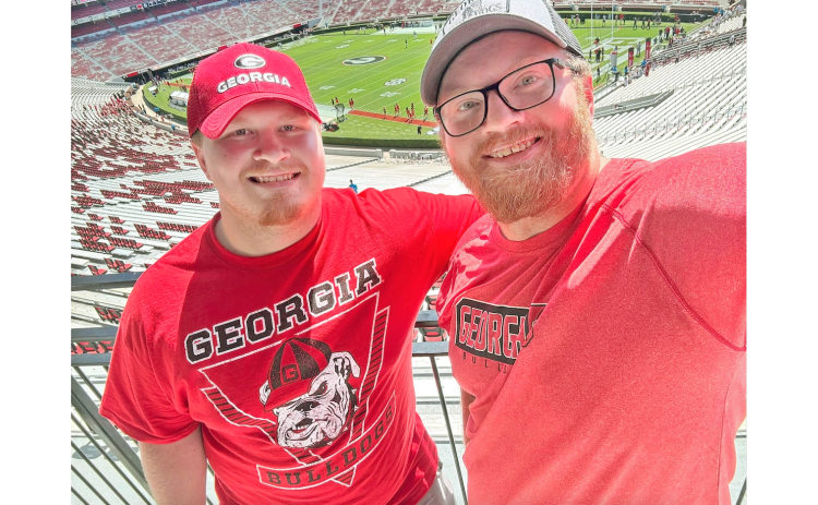 Nugget Staff Writer Eligha Roper (right) and his brother Ryan Roper take in the sights at Sanford Stadium.