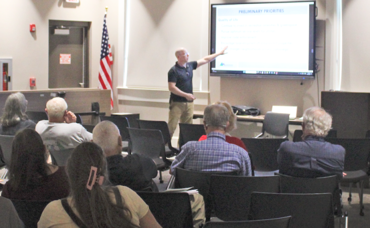 Georgia Mountains Regional Commission Planning & Information Services Director Adam Hazell reviews a list of priorities for the County’s next Comprehensive Plan during a meeting in the public library.