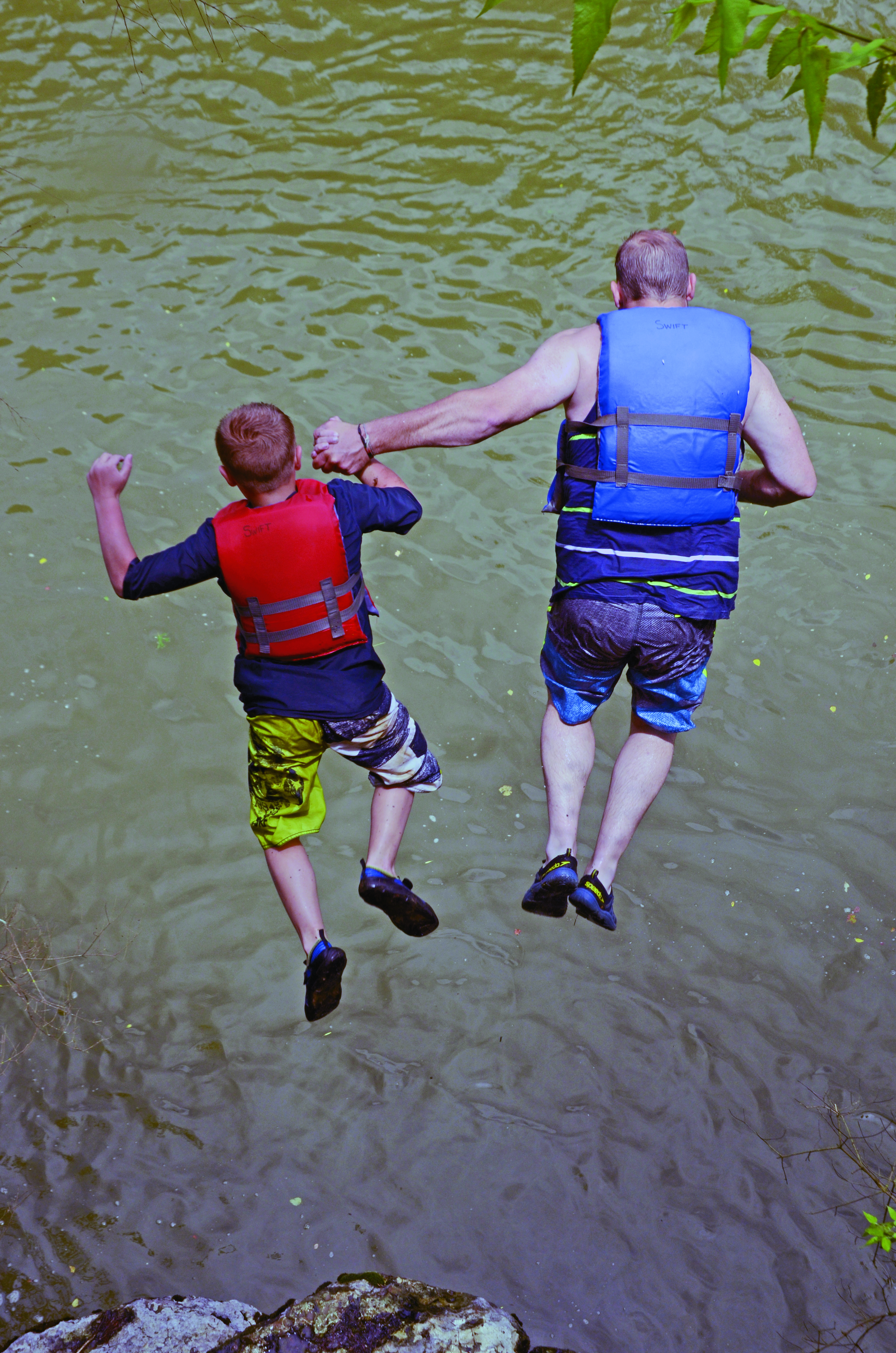 Participants in Paddle Georgia 2017 take a leap of faith into the Etowah River. (Photo/Joe Cook)