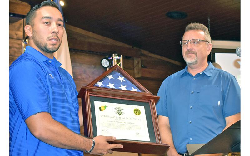 Recently returned Georgia National Guard 2nd Lt. Edgar Rojas (left) presents Pastor Jeff Pullium of Concord at Dahlonega with the flag that flew over the base at Nangarhar Province, Afghanistan where he was stationed. The presentation took place during the church’s recent Warrior Welcome Home celebration.