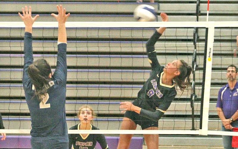 Lady Indians player Kiersta Trammell puts a powerful hit on the ball at the net for a kill during Lumpkin’s win over Prince Avenue Christian last week.