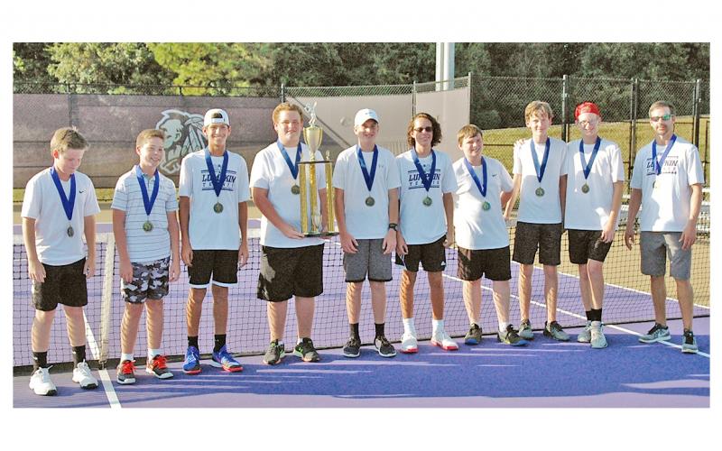 The Lumpkin County Middle School boys tennis team shows off their Mountain League Championship trophy after defeating White County last week. The win marked back-to-back championship titles for the Indians.