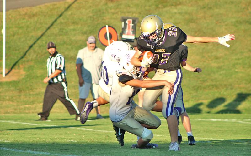 Lumpkin running back Mason Sullens keeps his feet to pick up some big yards for the Indians in the team’s final regular season game against the Union County Panthers.