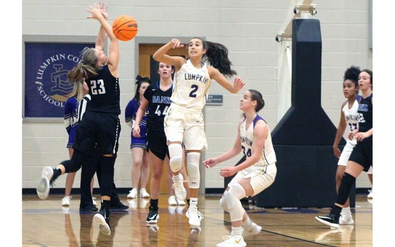 Lumpkin County’s Isabel Davenport forces a Lady Leopard turnover with her tenacious defense.