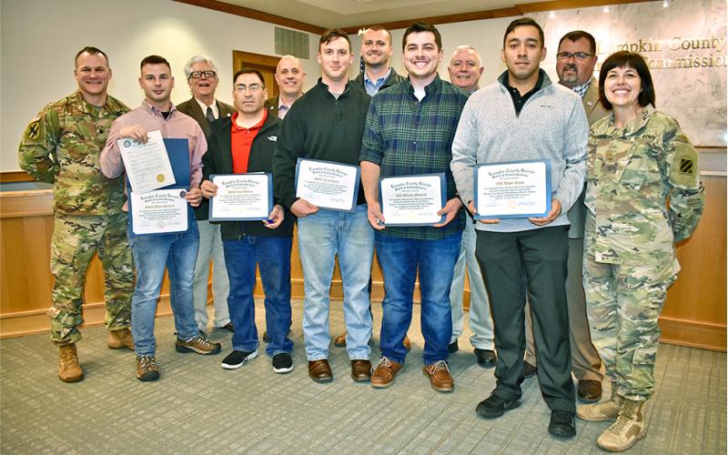 Local residents who served in the Georgia National Guard 48th Infantry Brigade were honored by Lumpkin County Board of Commissioners for their service in Afghanistan as one of the last acts of 2019. Attending last week’s meeting were (front row, from left) Lt. Comm. Nathaniel Stone; staff sergeants Ashton Sanford, Jose Alvarez and Nick Bauth,  1st lieutenants William Mayfield and Edgar Rojas and National Guard Chaplain Maj. Leslie Chandler. Board of Commissioners David Miller, Jeff Moran, Rhett Stringer, Bo