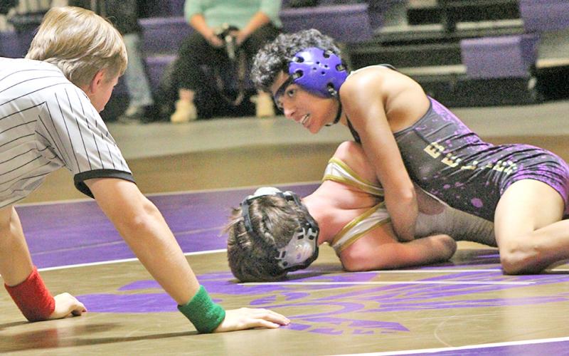 Jeremy Morales squeezes his opponent to try to get his shoulders to the mat during Lumpkin’s home dual versus Rabun Gap on T