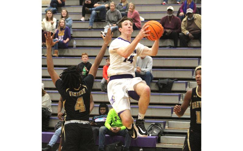 Standout Jacob Cumbie flies through the lane for two of his 17 points during Lumpkin’s region win over East Hall. Cumbie finished the game with a double-double, scoring 17 points and pulling down 10 rebounds.