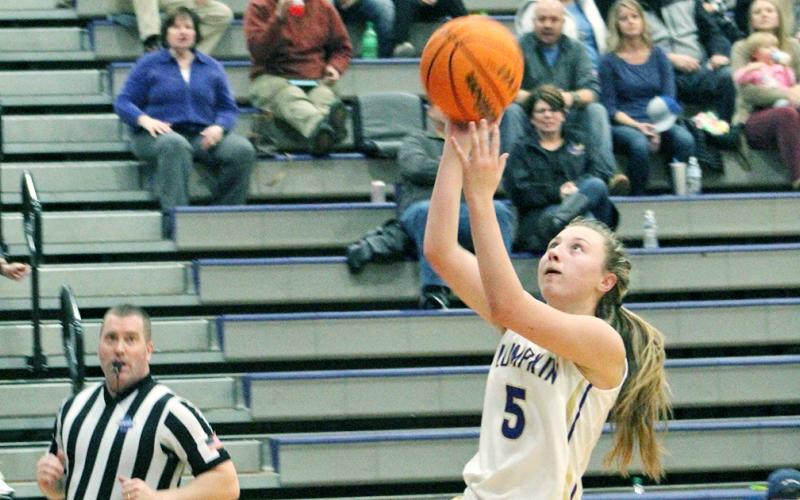 Lumpkin County guard Lexi Pierce finishes a fast break with an easy layup against the White County Lady Warriors. Pierce, a freshman, averaged just over 11.5 points a game during the team’s last three contests.