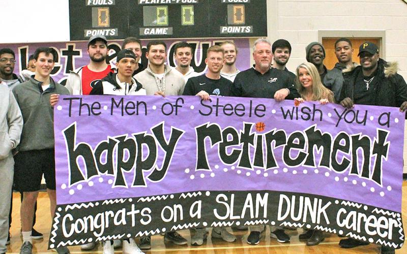 Former Johnson High School and Lumpkin basketball players celebrate the career of LCHS head boys basketball coach Jeff Steele after he announced his retirement.