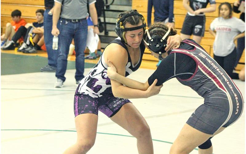 Lady Indians wrestler Olivia Gilleland locks up with one her opponents at the Burnt Mountain Classic. Gilleland won her first tournament championship of her career with a first place finish at the event.