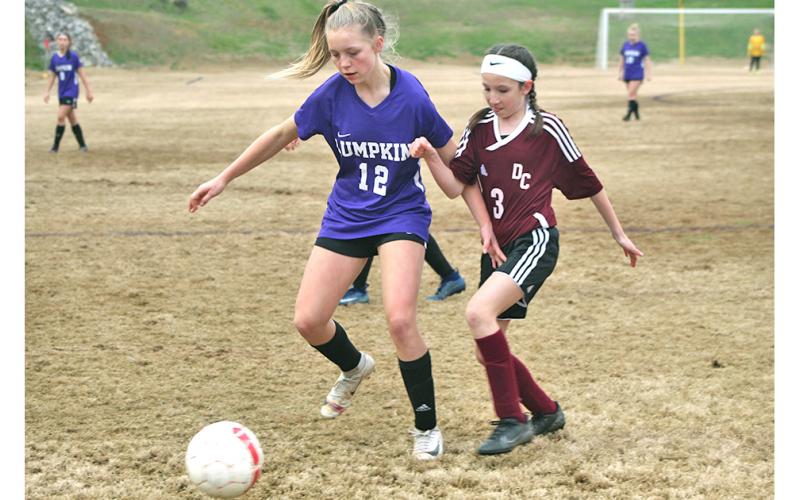 LCMS Lady Indians striker Ciera Brooks dribbles past a defender on her way to one of her three goals in Lumpkin’s win over rival Dawson County last week.