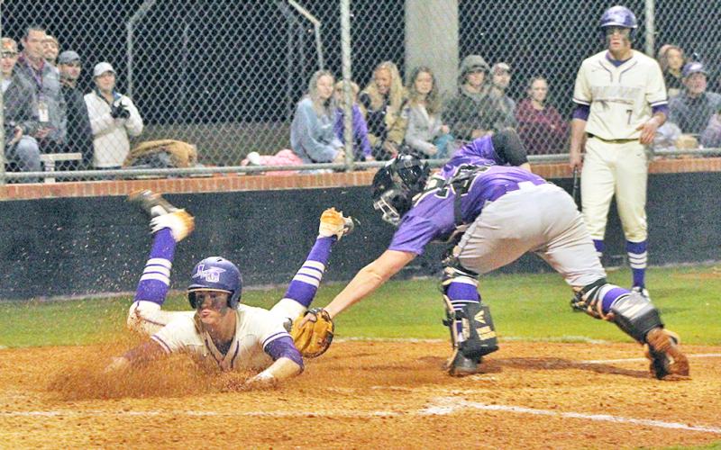 Lumpkin County’s Dalton Caldwell slides safely into home plate to score a run in Lumpkin’s 3-0 win over the Union County Panthers in their 2020 home opener on Tuesday, Feb. 25.
