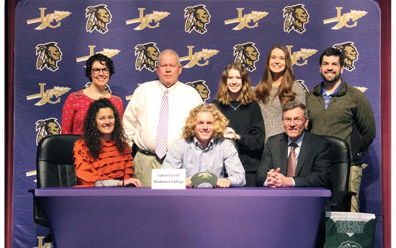 LCHS tennis star Laken Ferrell (center front) celebrates signing with Piedmont College at a recent signing ceremony held at the LHS auditorium. Pictured (back row, left to right): Abbey Ferrell, LCHS head tennis coach Alan Hogan, Claire Stephens, Erin Ferrell and Jay Ferrell. (Front row): Ferrell’s mother Paige Ferrell and Ferrell’s father Steve Ferrell.