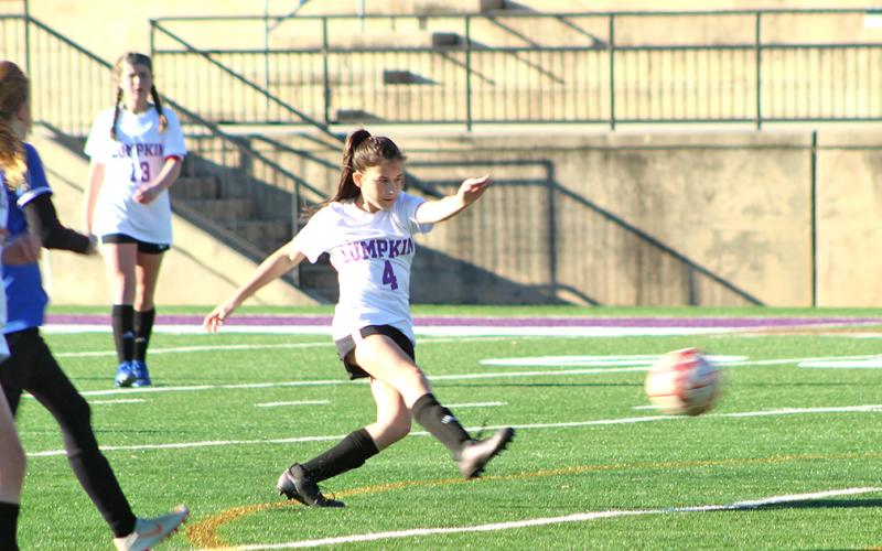 Lumpkin’s Della Marshall boots in one of her two goals in Lumpkin’s 10-0 win over the Fannin County Lady Rebels last week.
