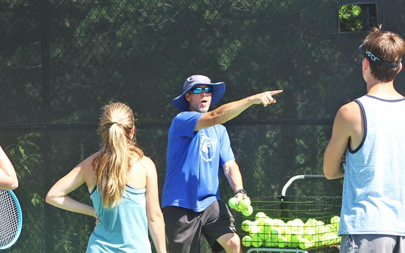 UNG head tennis coach gives instructions for a drill to campers of the UNG tennis camp last week. 