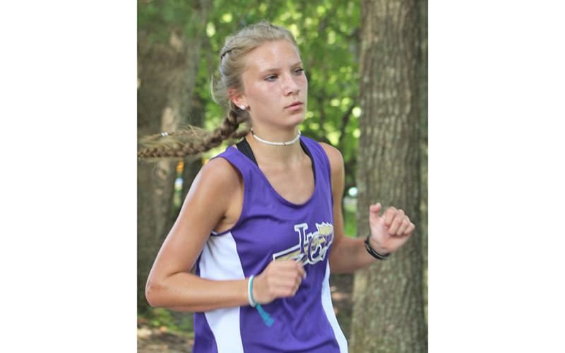 Lady Indians star runner Abbie Hilchie leads the pack halfway through the Union County Invitational. Hilchie led the team to a first place team finish with a fifth place individual finish at the 2020 season opening meet.
