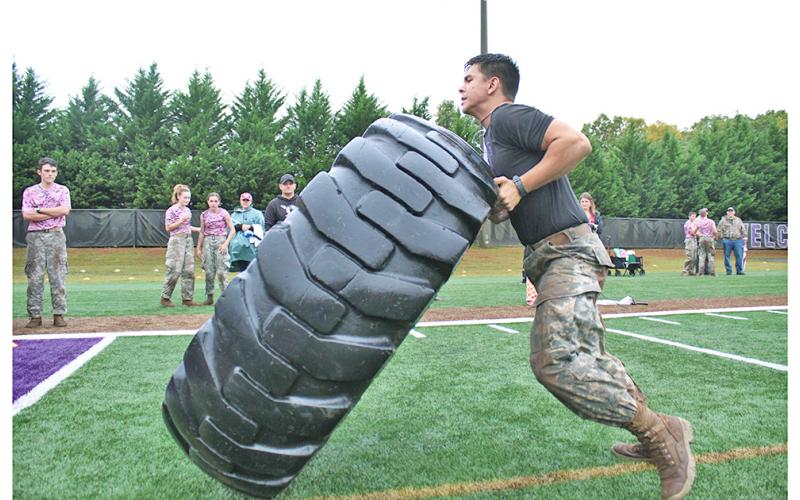 Mario Mendoza muscles his way underneath the edge of a giant tire, lifting with his legs in an explosive burst before flipping the tire with a powerful push. The tire flips are only one component of a relay style race known as the Beast Events.