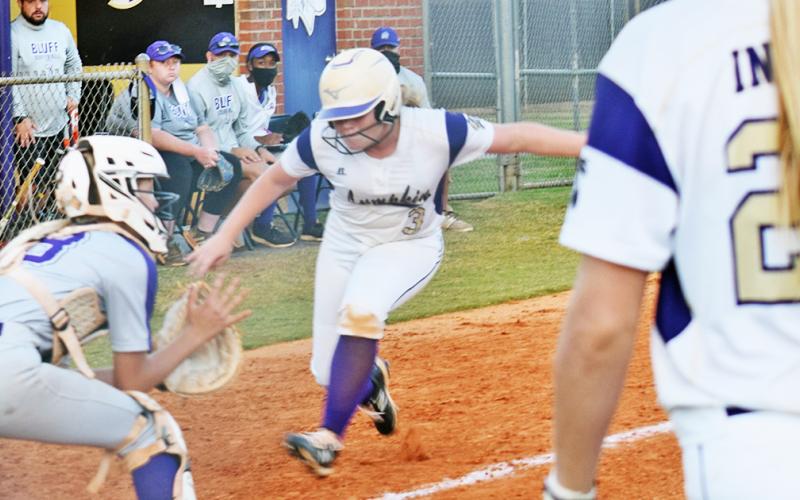 Lumpkin’s Amma Johnson heads home for a play at the plate in the Lady Indians game versus Cherokee Bluff.