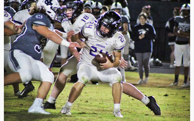 Lumpkin County freshman running back Will Wood fights the Warriors defense for every yard during Friday’s loss to White County.