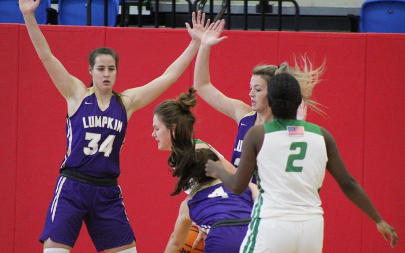 The Lady Indians defense was stout in their game against Franklin County as MaKenzie Caldwell (left) and Madison Powell put pressure on the ball-handler in hopes of forcing a turnover. The suffocating Lumpkin defense allowed only 20 points in its tournament finale, walking away with a 2-1 record to start the season.