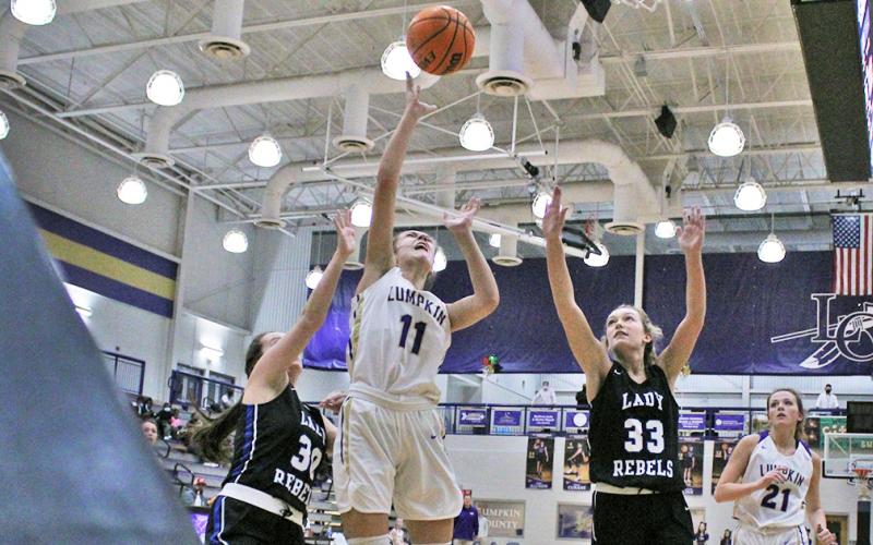 Mary Mullinax puts up a shot from the low post in the the girls’ opening game of the Kelly King Holiday Classic. Mullinax scored a season-high 13 points against Fannin in the team’s first game of the tournament on Monday, December 21.