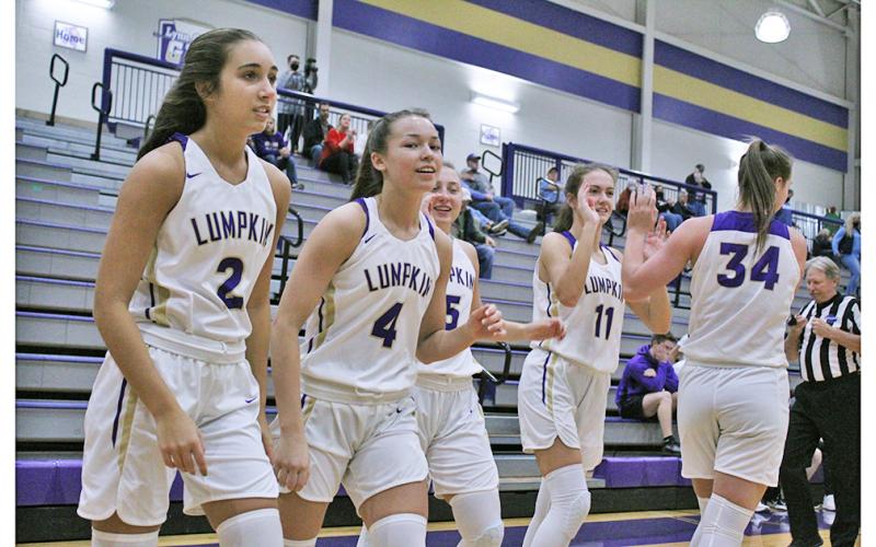 The LCHS girls basketball team starting five hype each other up before the start of a game. The Indians won in commanding fashion on Saturday, beating Lakeview Academy by 64 points.