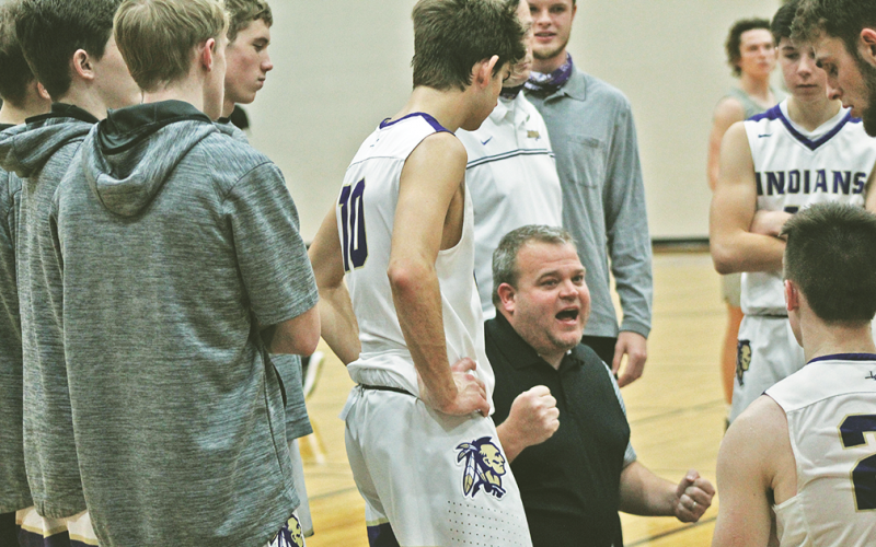 Head coach Michael Parker encourages his team during a timeout in Lumpkin County’s crucial region-win over Gilmer County on Friday. Parker’s team was 9-9 as it headed into yet another crucial region-matchup with North Hall on Tuesday.