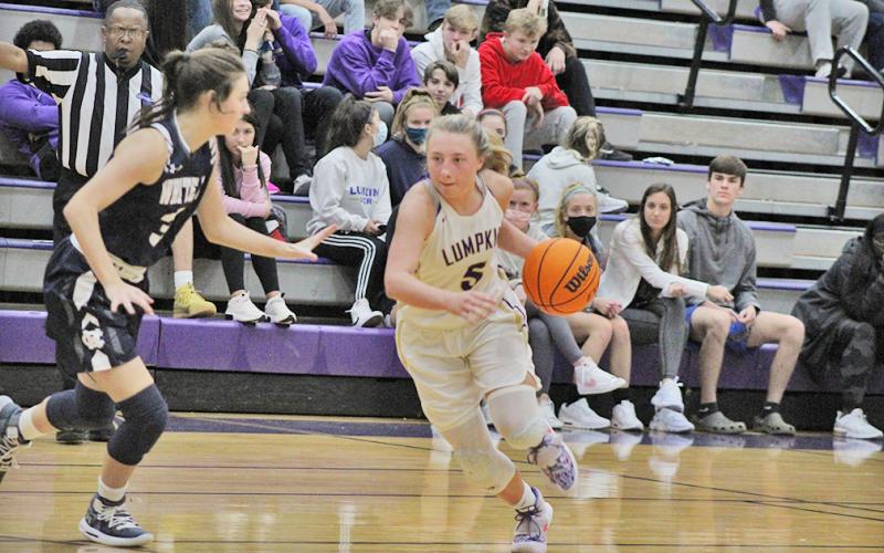 LCHS sophomore Lexi Pierce drives past a defender during Lumpkin’s region game versus White County last Tuesday. The Indians’ one-point overtime loss was their first region loss of the season and only their fourth loss all together this season.
