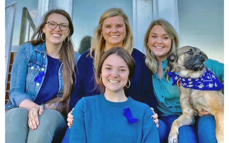 South Enotah Child Advocacy Center members are, from left, Executive Director Rebekah Perethian, Forensic Interviewer Kylee Martin, Family Advocate Carlyn Hearn, Facility Dog Jake Martin and, front, Family Advocate Megan Holcombe.